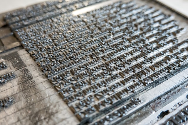 Picture of a close-up of a metal type letterpress.