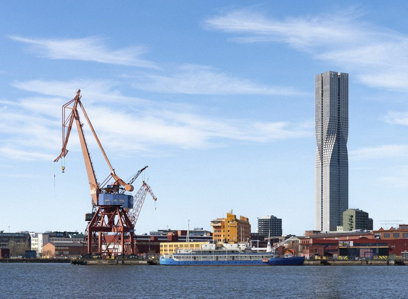 Harbour with cranes and tall building